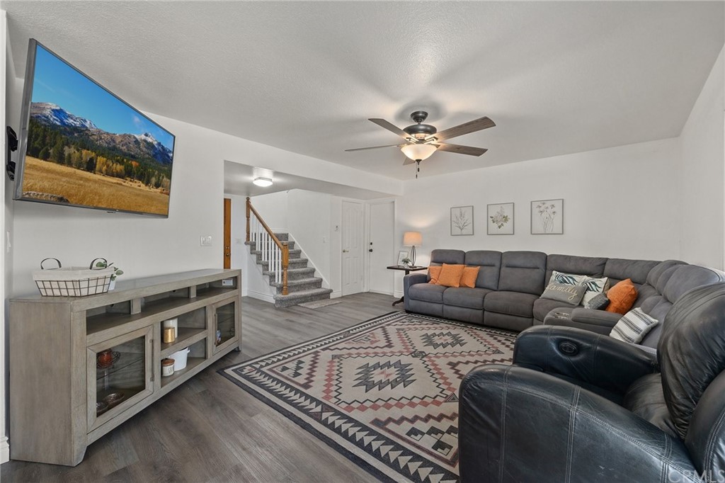 10221 Beaver Circle Cypress, CA 90630 - Photo 10 of 26 a living room with furniture and a chandelier