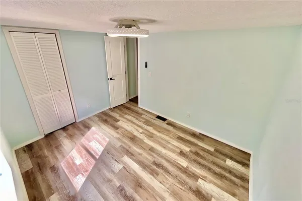 a view of balcony with wooden floor