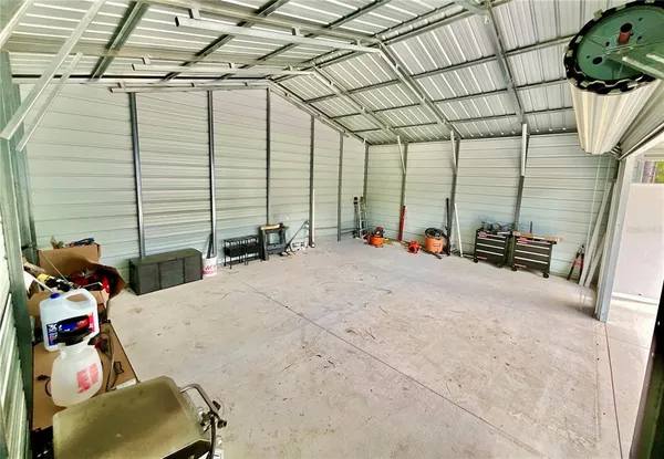 a backyard of a house with wooden floor and fence
