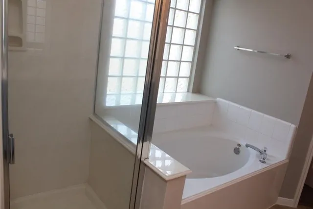 a white bath tub sitting next to a window