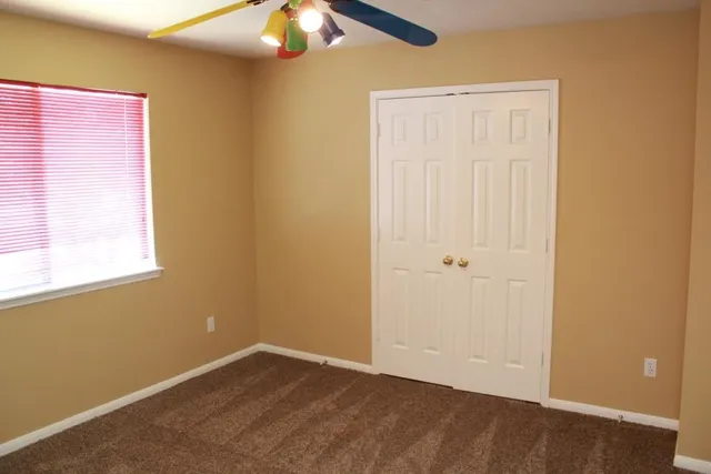 an empty room with a empty space and a window