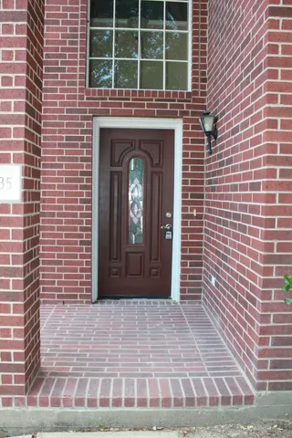a view of a brick house with a door