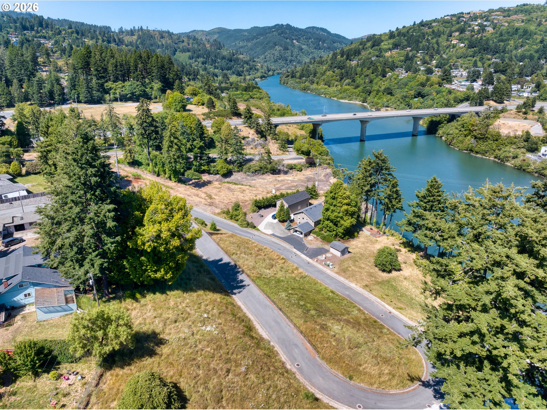 Riverview Drive, Unit 5 Brookings, OR 97415 - Photo 6 of 12 a view of a lake from a balcony