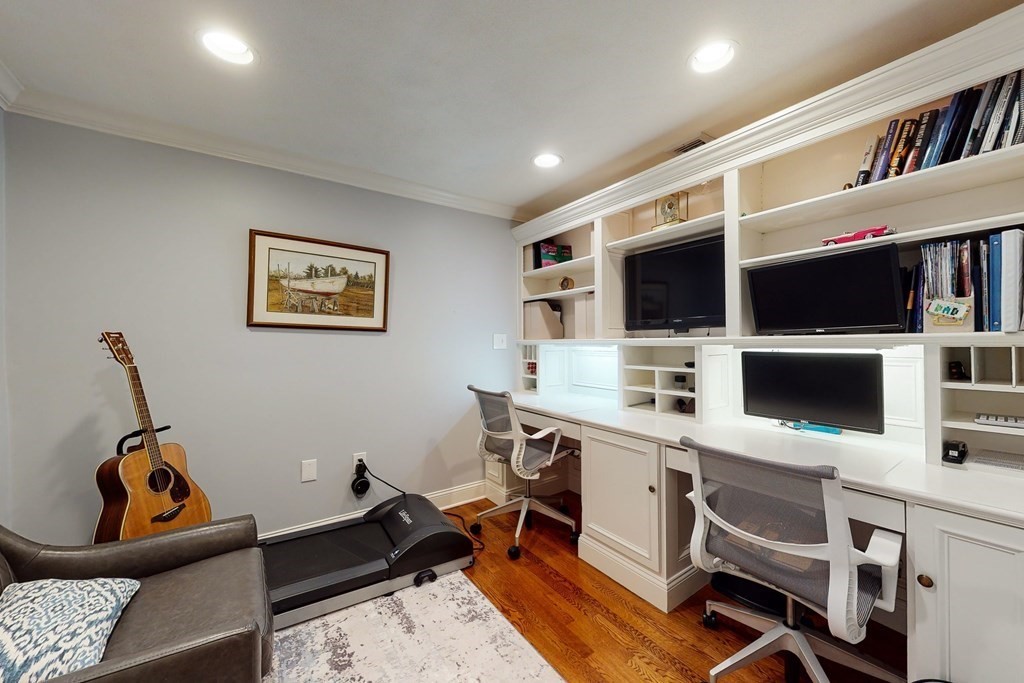 23 Pinckney Street, Unit 1 Boston, MA 02114 - Photo 17 of 17 a view of a workspace with furniture and a flat screen tv