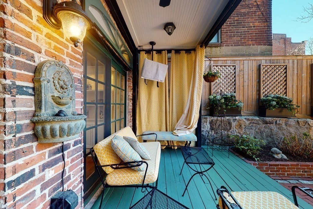 23 Pinckney Street, Unit 1 Boston, MA 02114 - Photo 6 of 17 a view of balcony with wooden floor and outdoor seating