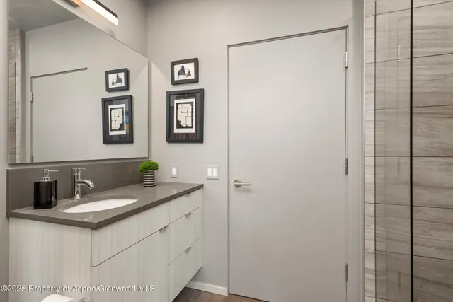 a bathroom with a sink and a mirror