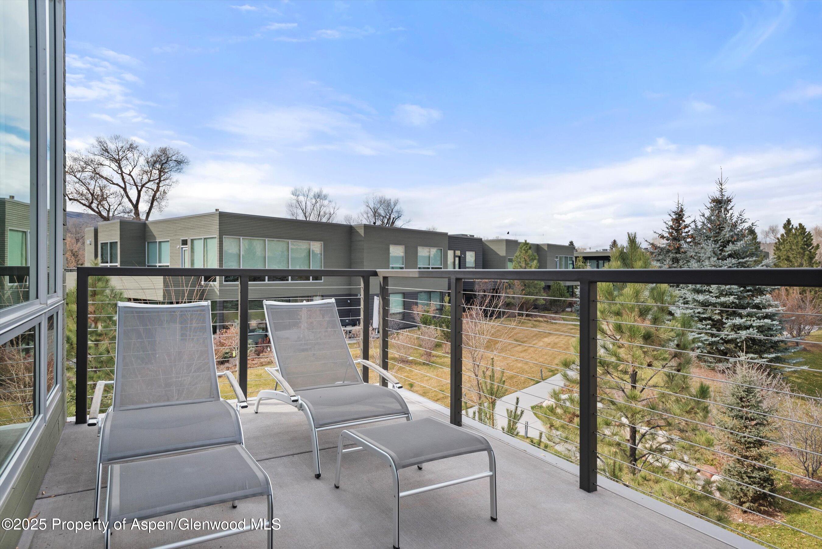 103 Willits Lane, Unit 204 Basalt, CO 81621 - Photo 21 of 24 a view of a patio with couches chairs with wooden floor