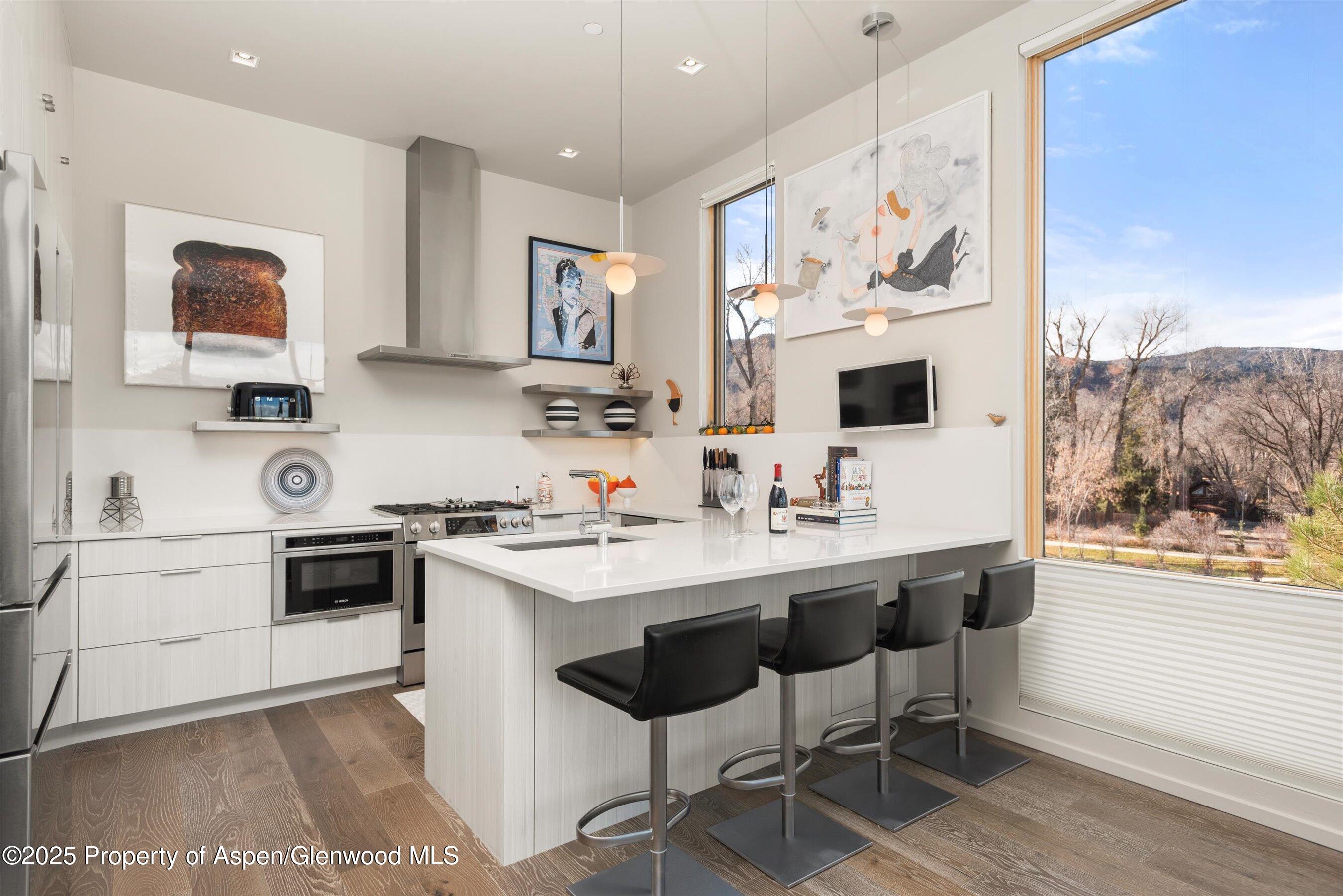 103 Willits Lane, Unit 204 Basalt, CO 81621 - Photo 7 of 24 a kitchen with a sink cabinets and wooden floor