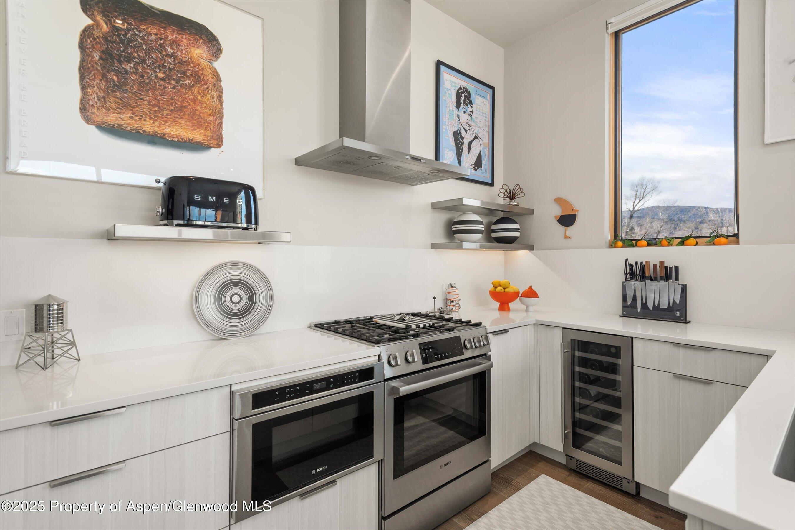 103 Willits Lane, Unit 204 Basalt, CO 81621 - Photo 9 of 24 a kitchen with a stove and a microwave