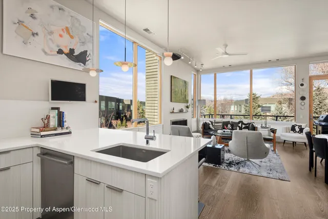a view of a kitchen with a large window