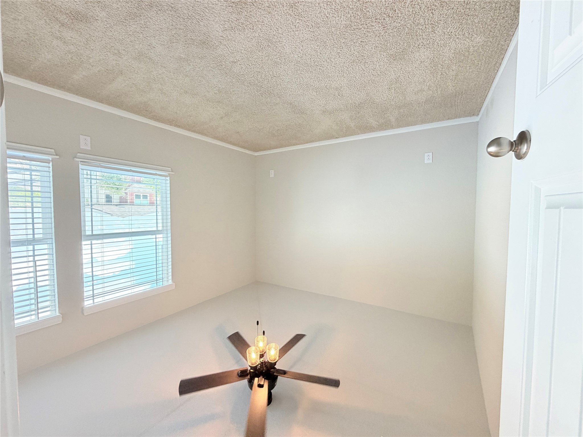10502 Fulton Avenue Austin, TX 78754 - Photo 27 of 36 A well-lit bedroom offering a blank canvas for personalization.