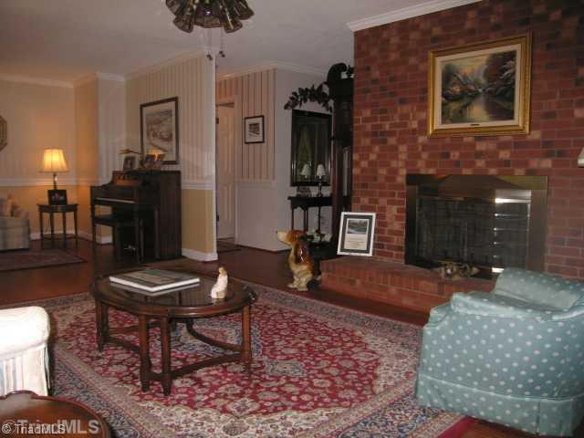 4745 Old Julian Road Julian, NC 27283 - Photo 8 of 16 Living Room. Living Room with raised hearth and gas log fireplace.
