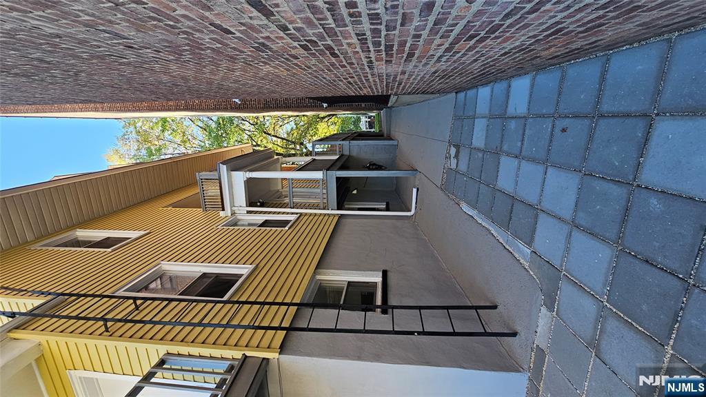 78 North Arlington Avenue, Unit 3 East Orange, NJ 07017 - Photo 11 of 13 a view of a house with a yard