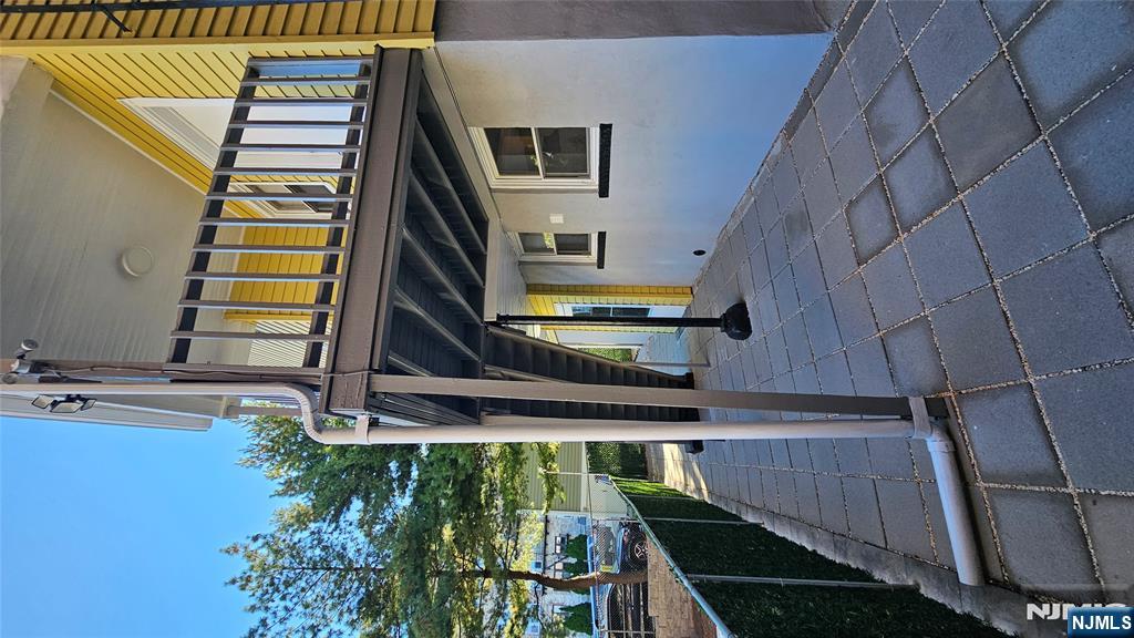 78 North Arlington Avenue, Unit 3 East Orange, NJ 07017 - Photo 12 of 13 a view of house with a large window and potted plants