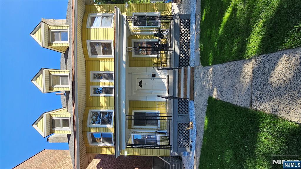 78 North Arlington Avenue, Unit 3 East Orange, NJ 07017 - Photo 9 of 13 a front view of building with outdoor seating and yard
