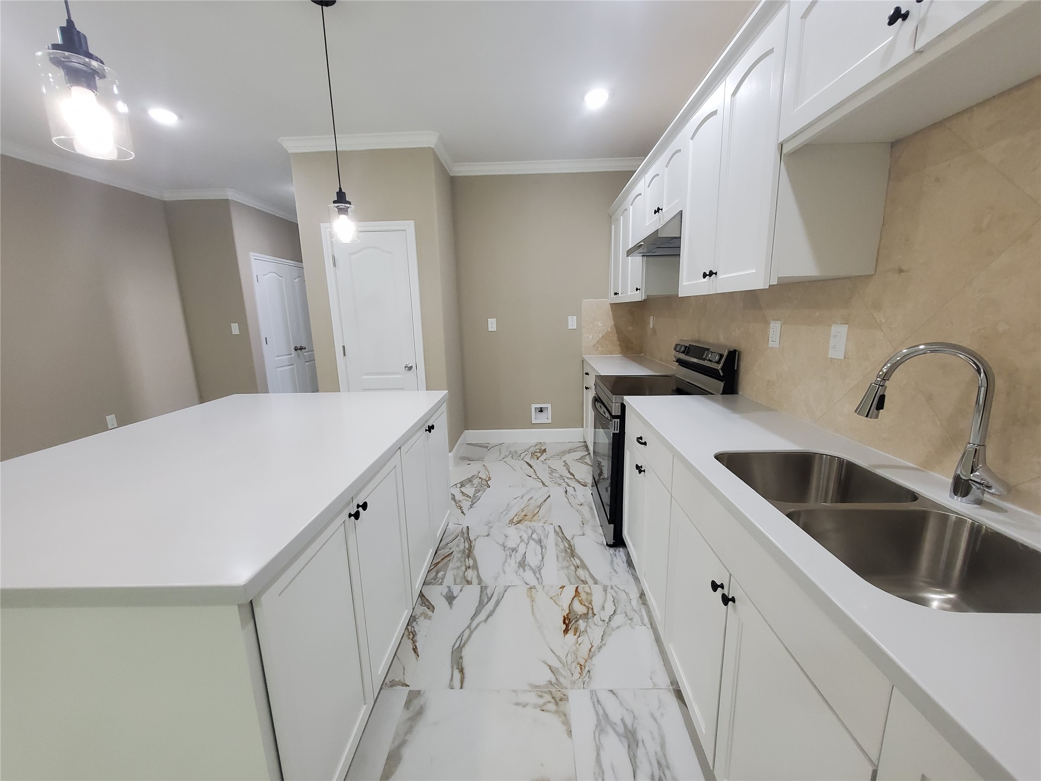 1306 North 9th Street Conroe, TX 77301 - Photo 6 of 47 a kitchen with a sink a stove a refrigerator and cabinets