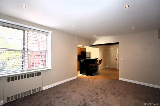 a view of livingroom with furniture and a window