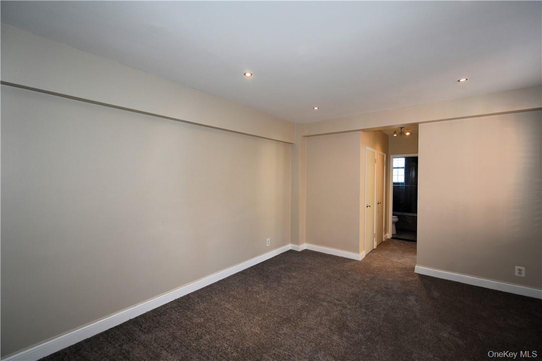 796 Bronx River Road, Unit B38 Bronxville, NY 10708 - Photo 14 of 21 an empty room with an entryway