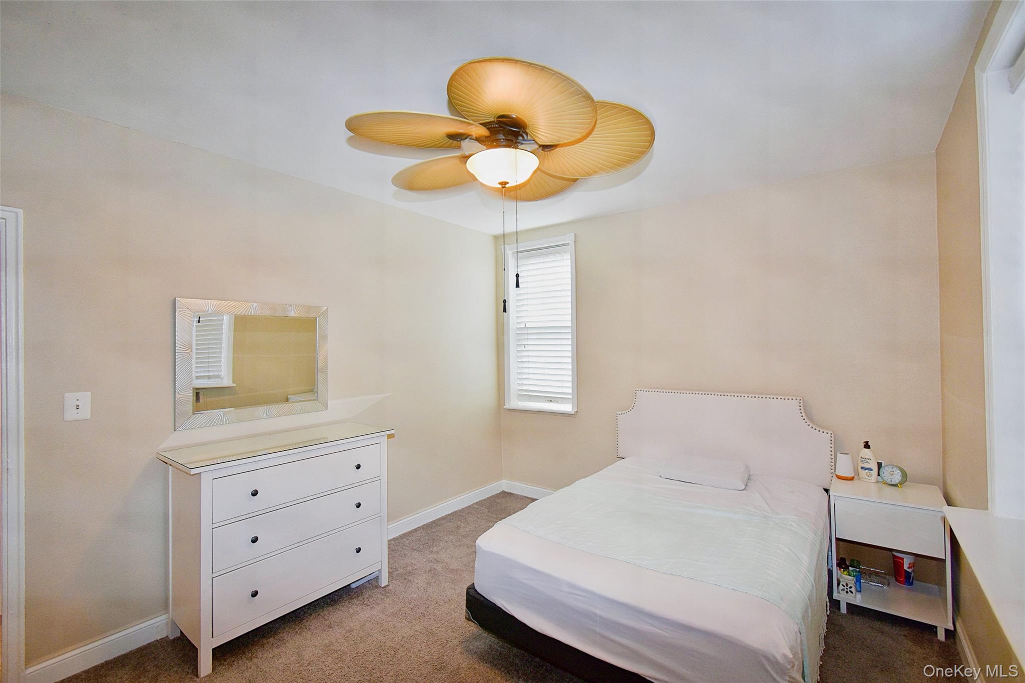 796 Bronx River Road, Unit B38 Bronxville, NY 10708 - Photo 18 of 21 a bedroom with a bed and a chandelier