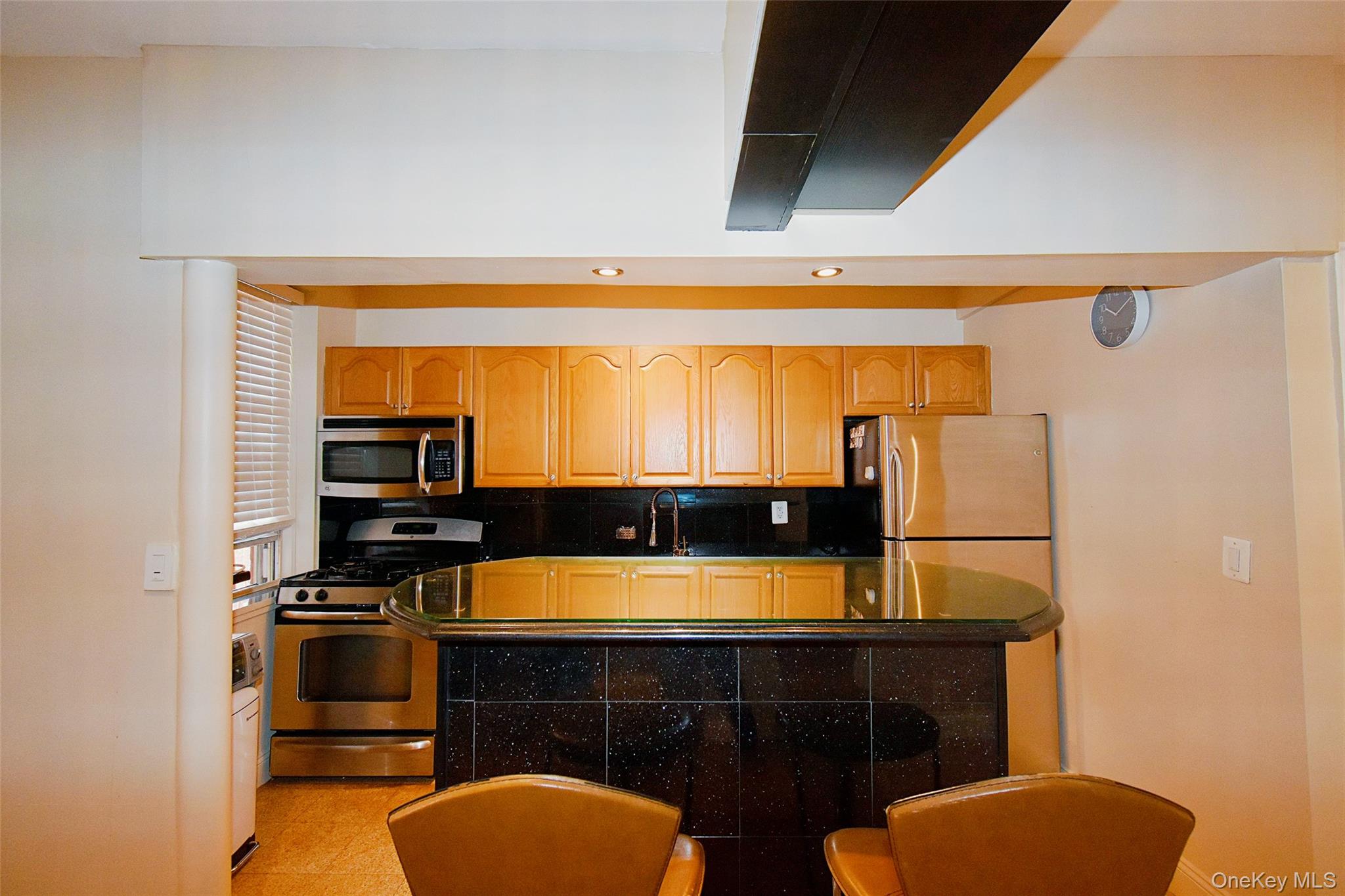 796 Bronx River Road, Unit B38 Bronxville, NY 10708 - Photo 4 of 21 a room with chairs a washer and dryer