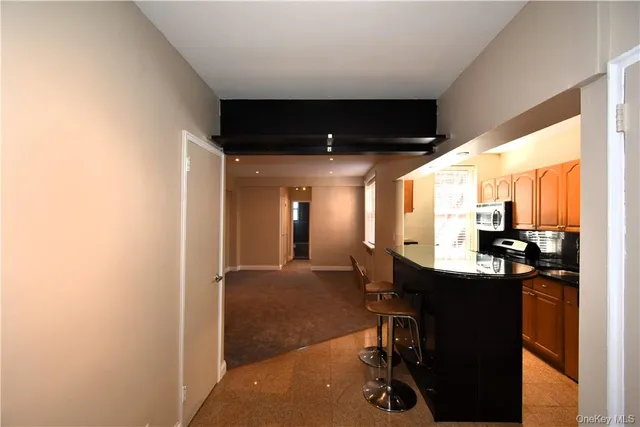 a view of a room with a table and chairs