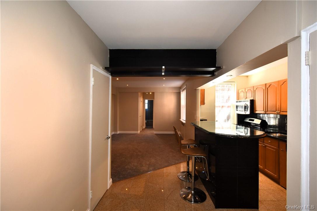 796 Bronx River Road, Unit B38 Bronxville, NY 10708 - Photo 8 of 21 a view of a room with a table and chairs