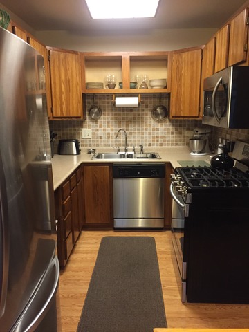 3638 Harlem Avenue Riverside, IL 60546 - Photo 12 of 21 a kitchen with a sink stove and cabinets