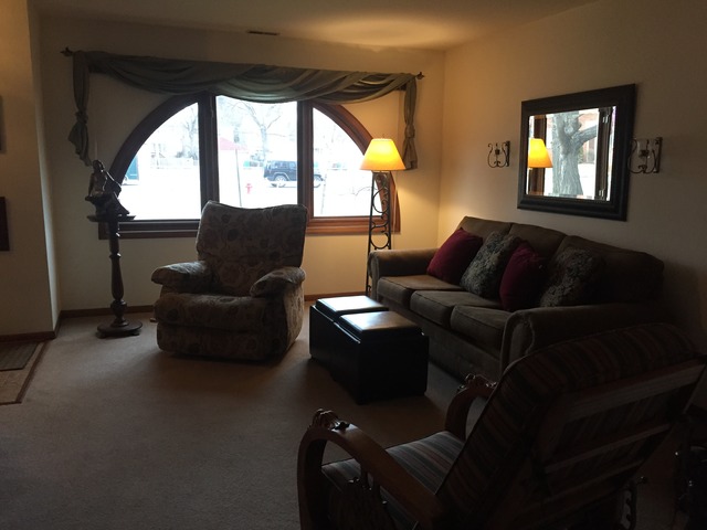 3638 Harlem Avenue Riverside, IL 60546 - Photo 8 of 21 a living room with furniture and a large window