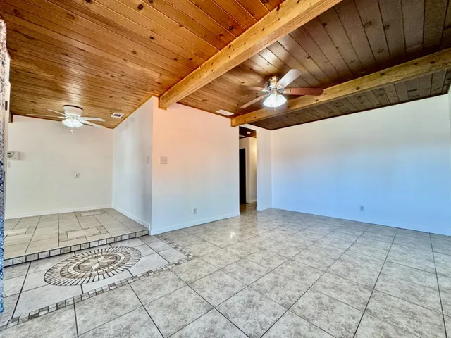 a view of a room with wooden walls