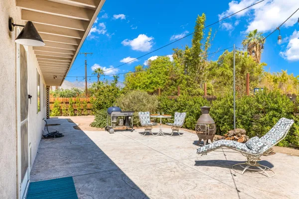 a view of a patio with swimming pool