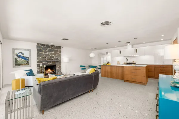 a living room with furniture and a fireplace