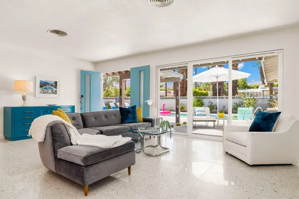 a living room with furniture and a large window