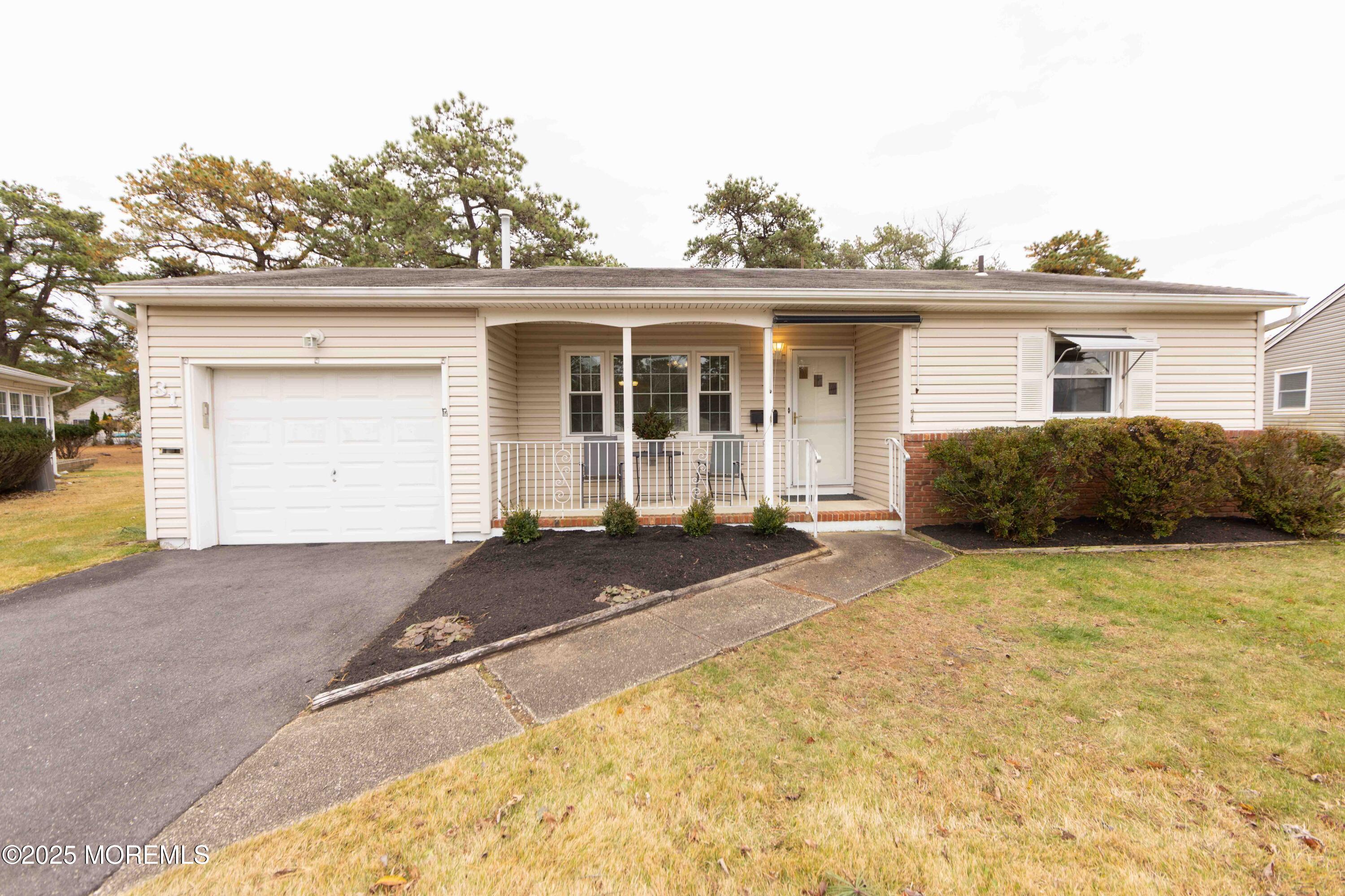 31 Southampton Road Toms River, NJ 08757 - Photo 1 of 14 a front view of a house with garden