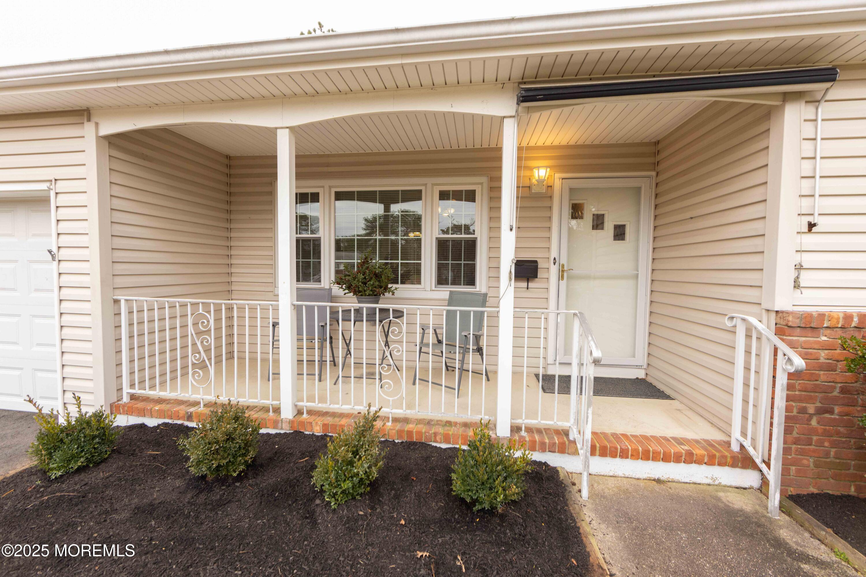 31 Southampton Road Toms River, NJ 08757 - Photo 13 of 14 a front view of a house with a large window and chair