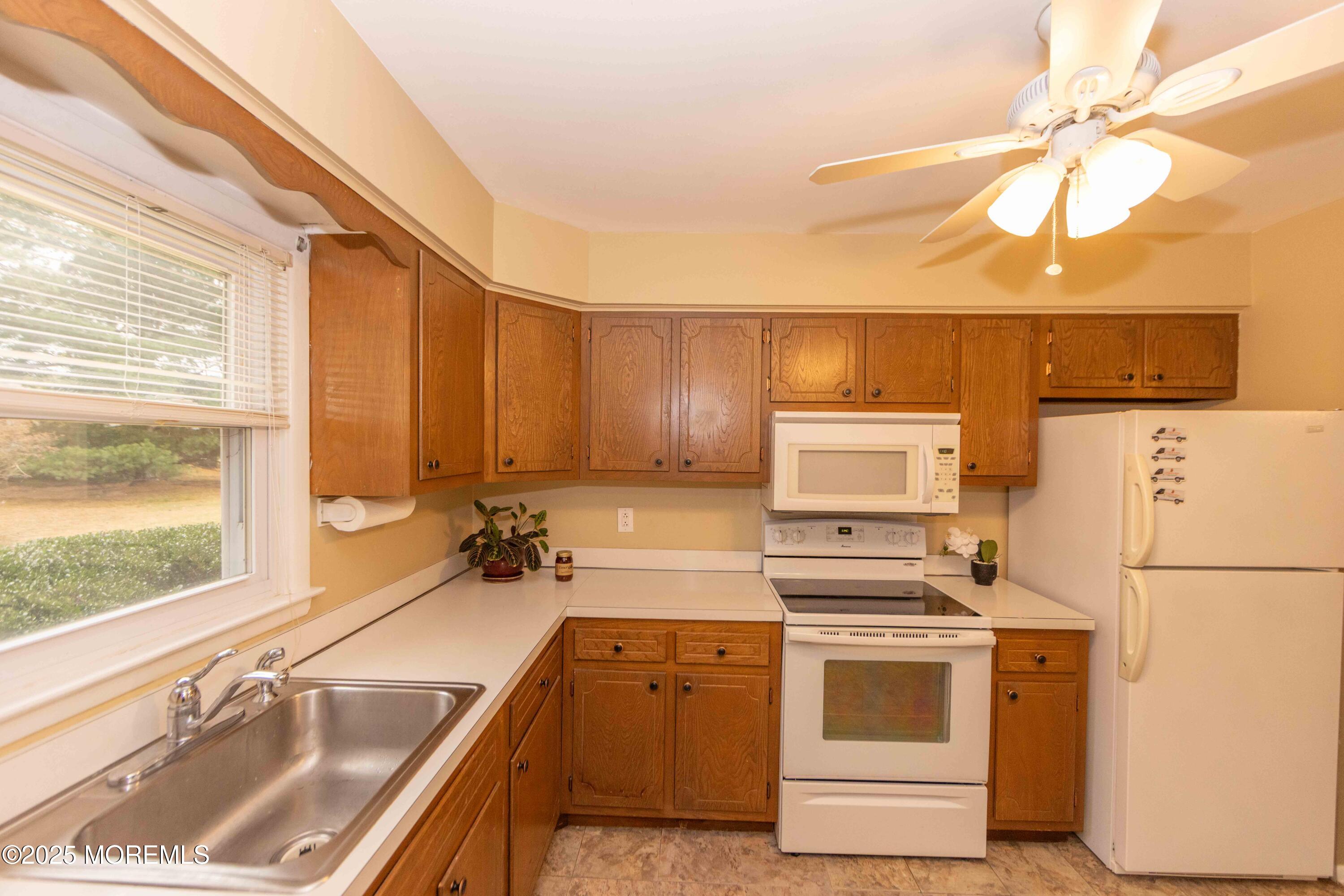 31 Southampton Road Toms River, NJ 08757 - Photo 5 of 14 a kitchen with a stove a sink and a refrigerator