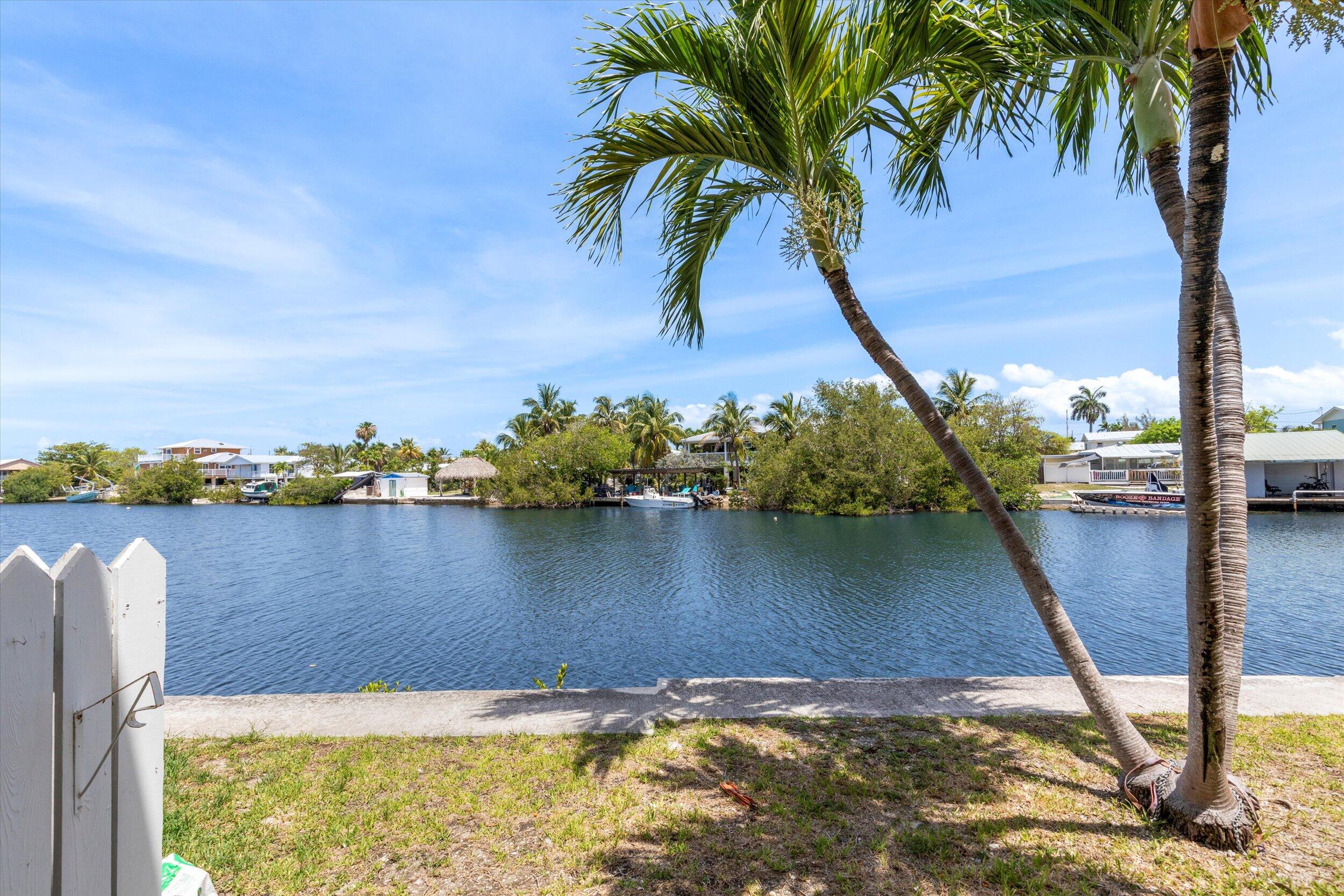 201 Coppitt Road, Unit 104C Key West, FL 33040 - Photo 16 of 18 a view of a lake with a beach