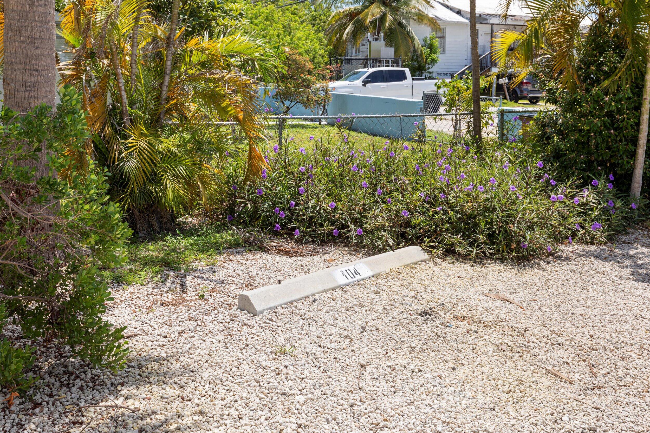 201 Coppitt Road, Unit 104C Key West, FL 33040 - Photo 18 of 18 a view of a yard with plants and large trees