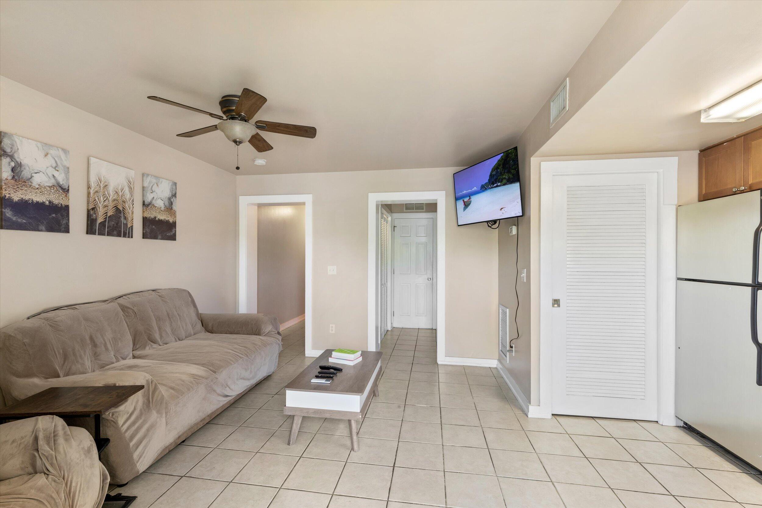 201 Coppitt Road, Unit 104C Key West, FL 33040 - Photo 6 of 18 a living room with furniture and a ceiling fan