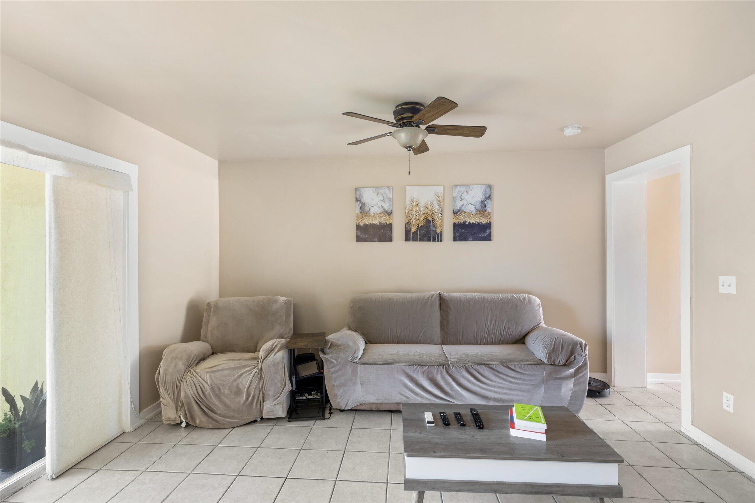 201 Coppitt Road, Unit 104C Key West, FL 33040 - Photo 7 of 18 a living room with furniture and a rug