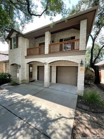 a front view of a house with yard