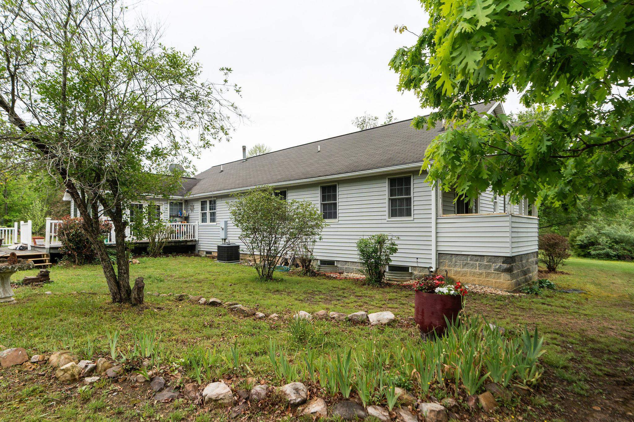 516 Estaline Valley Road Craigsville, VA 24430 - Photo 53 of 75 a view of a backyard with a garden
