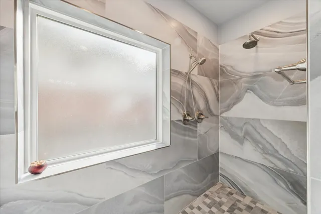 a spacious bathroom with a double vanity sink double and a mirror