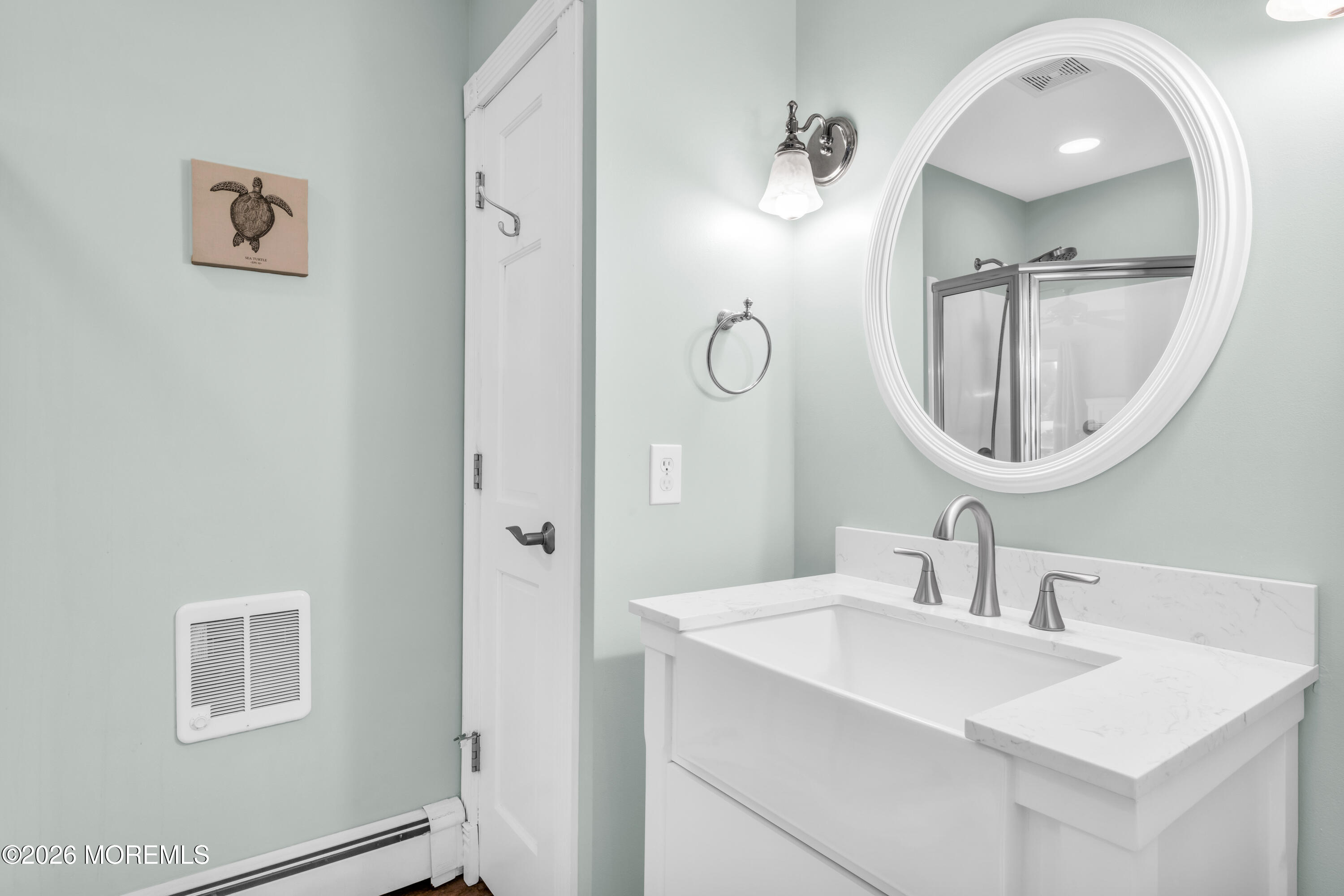 39 Pilot Road Toms River, NJ 08753 - Photo 13 of 34 a bathroom with a sink and a mirror