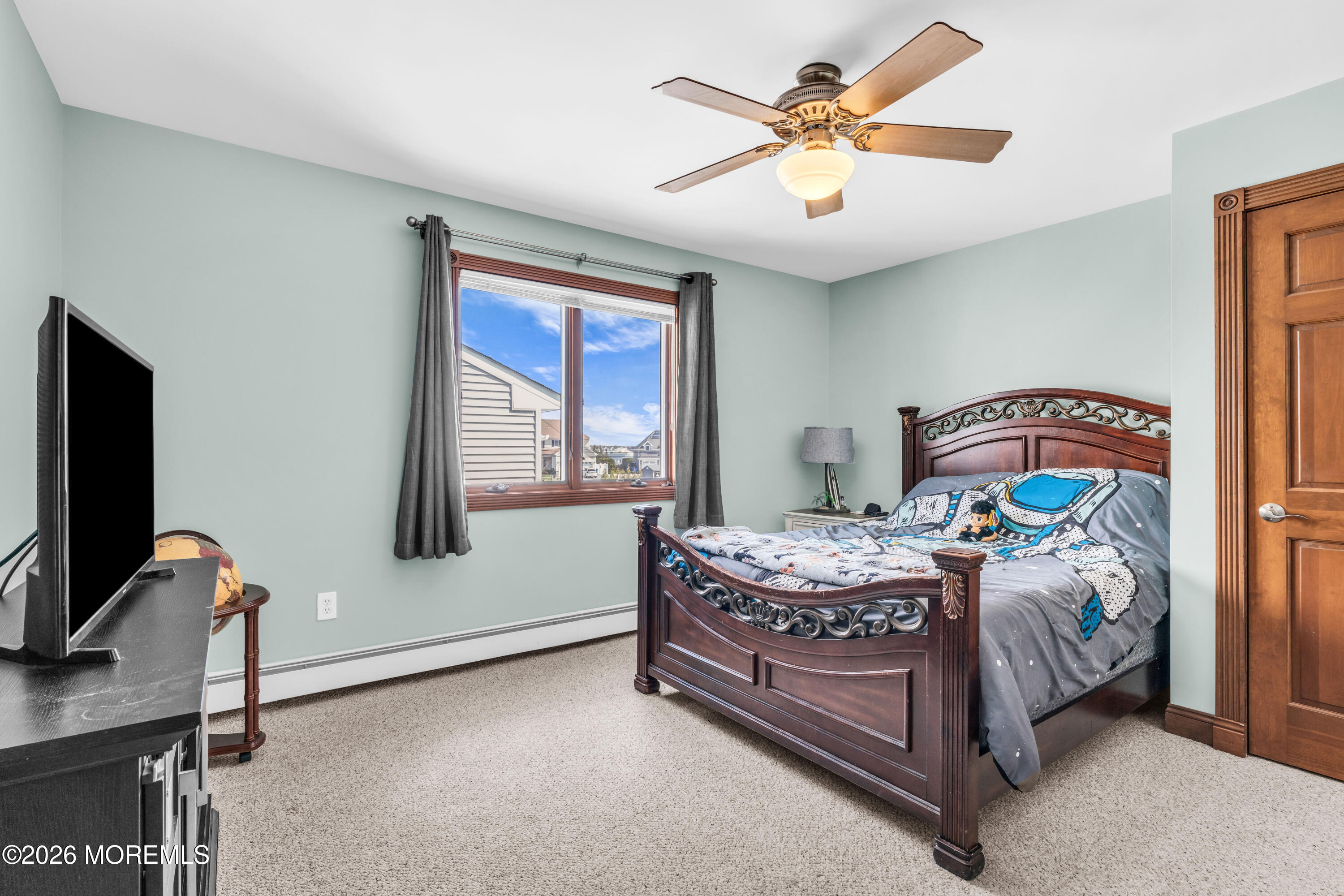39 Pilot Road Toms River, NJ 08753 - Photo 16 of 34 a bedroom with a bed and a chandelier