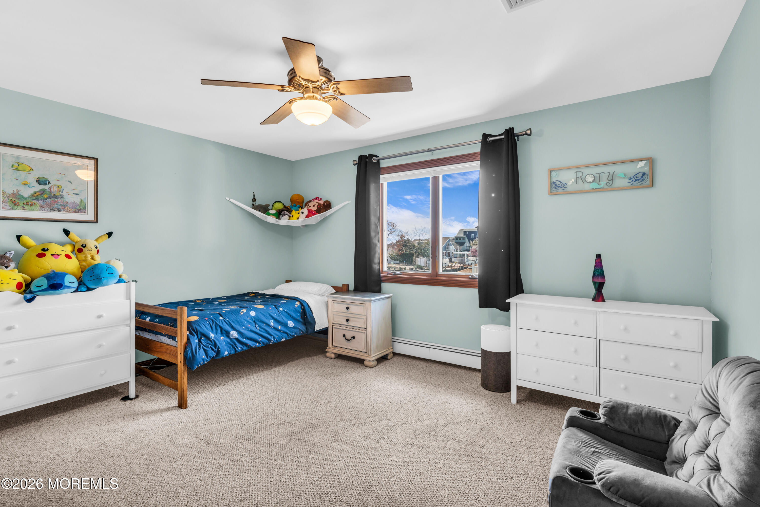 39 Pilot Road Toms River, NJ 08753 - Photo 17 of 34 a living room with a bed and a window