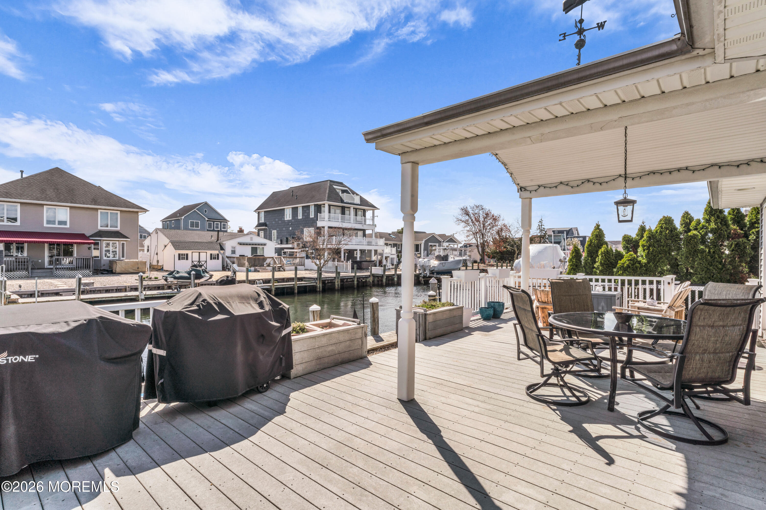 39 Pilot Road Toms River, NJ 08753 - Photo 20 of 34 a view of a rooftop deck and dining room with furniture