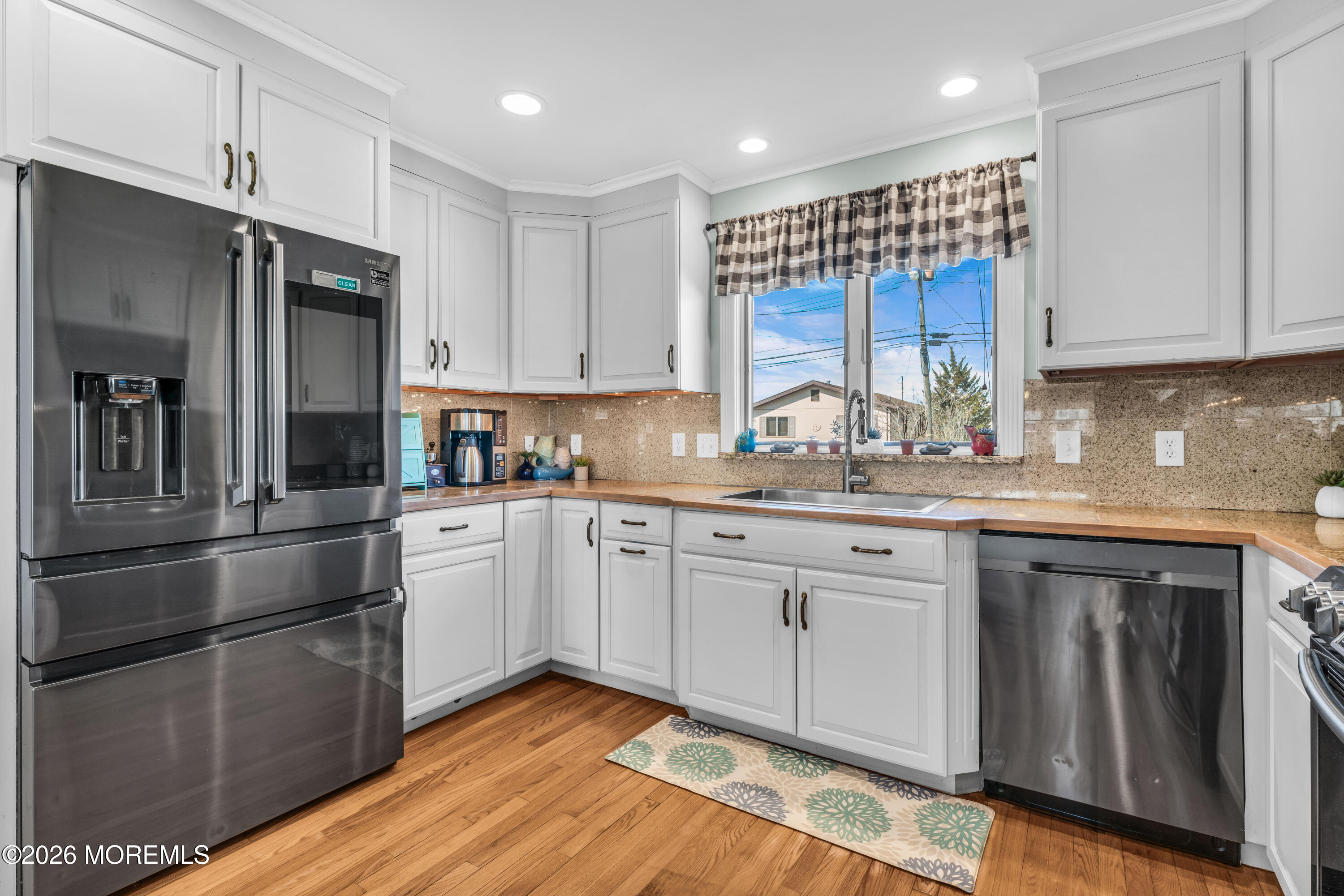 39 Pilot Road Toms River, NJ 08753 - Photo 5 of 34 a kitchen with stainless steel appliances granite countertop a stove a sink and white cabinets