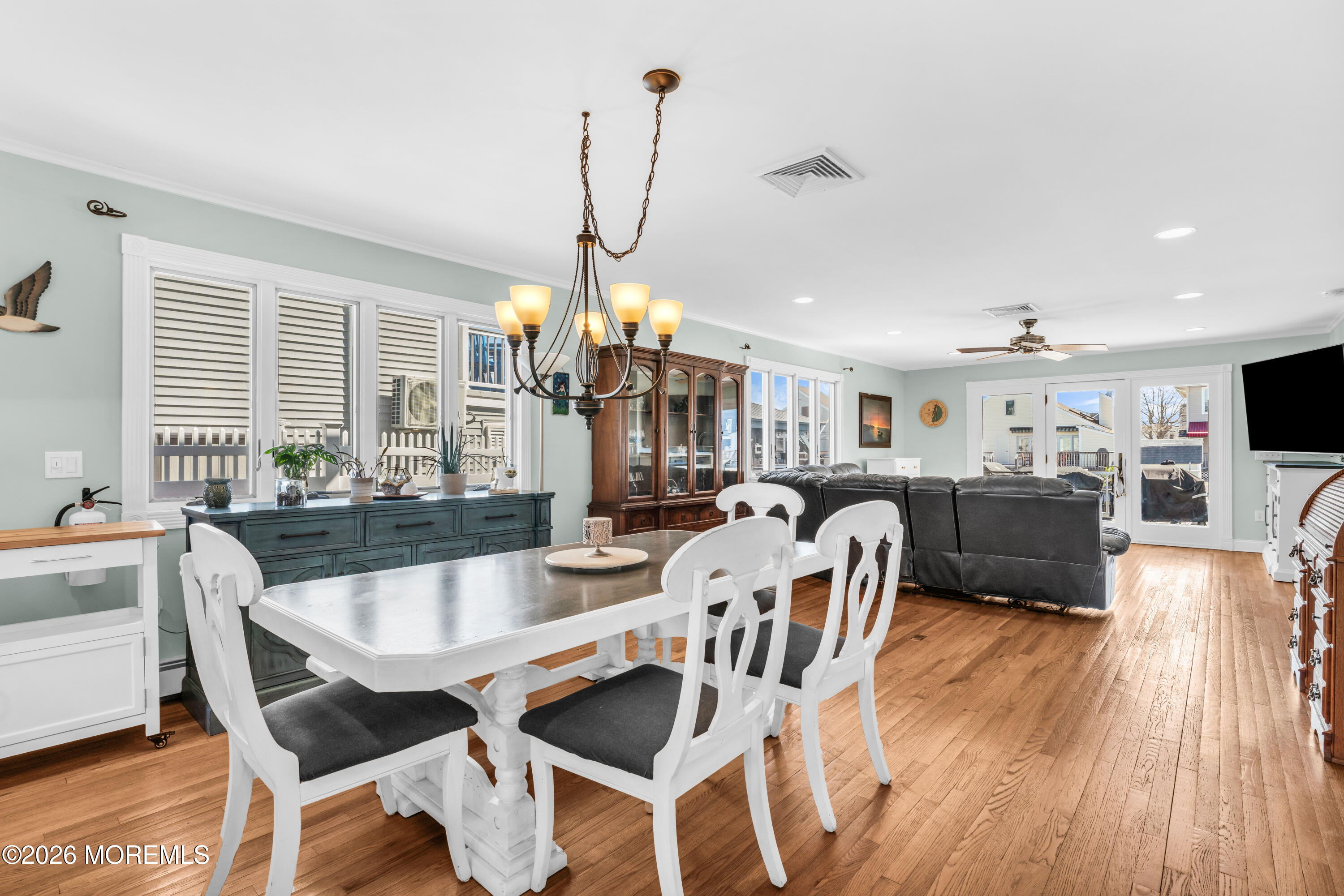 39 Pilot Road Toms River, NJ 08753 - Photo 6 of 34 a view of a dining room and livingroom with furniture wooden floor a chandelier