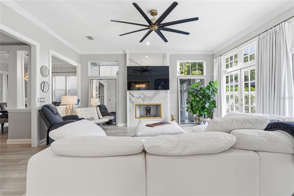 824 South Rome Avenue Tampa, FL 33606 - Photo 13 of 45 a living room with fireplace furniture and a flat screen tv