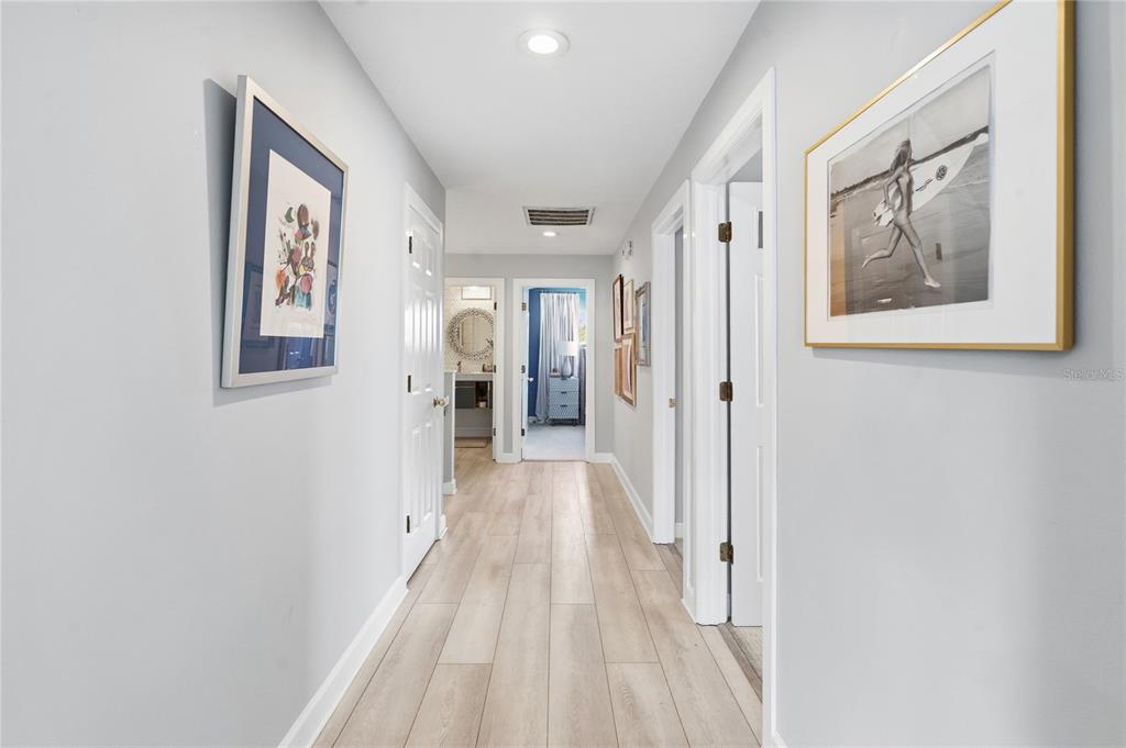824 South Rome Avenue Tampa, FL 33606 - Photo 34 of 45 a view of a hallway with wooden floor and closet